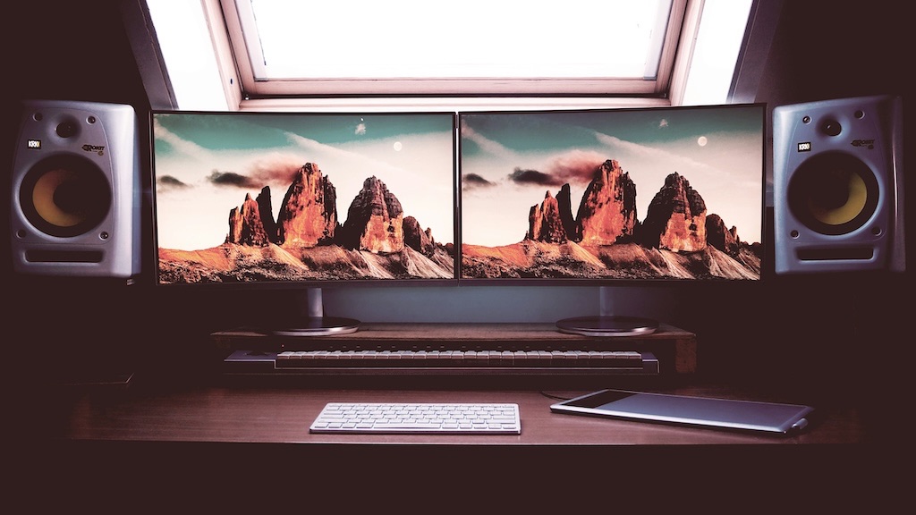 Two computer displays side by side showing the same image